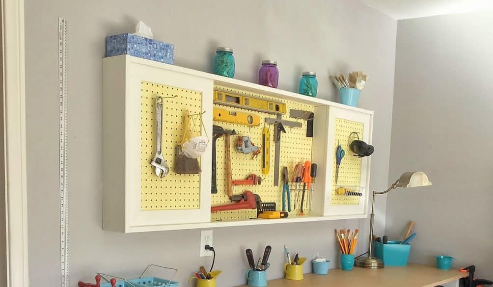 DIY-tutorial-to-build-a-workbench-and-pegboard-tool-cabinet-with-sliding-doors-featured-on-Remodelaholic