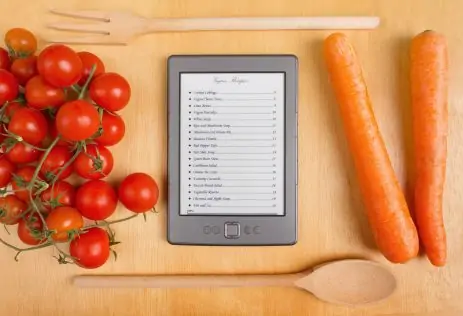 List of Recipes on a Tablet among Tomatoes and Carrots