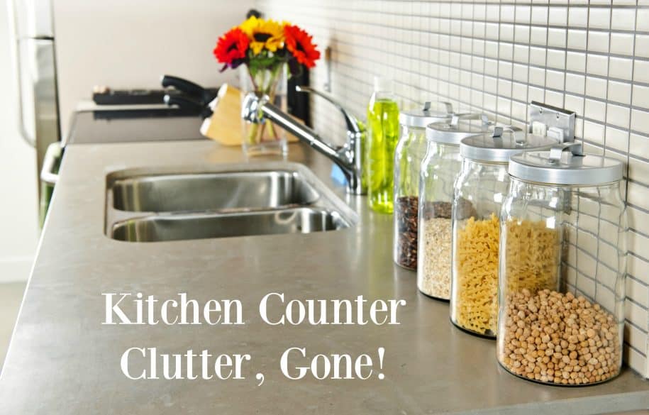 Modern small kitchen interior with glass jars on natural stone countertop