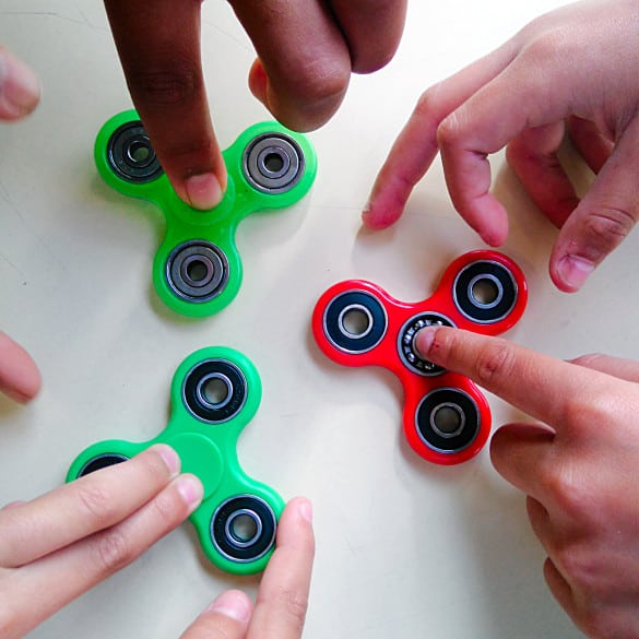 green and red fidget spinners