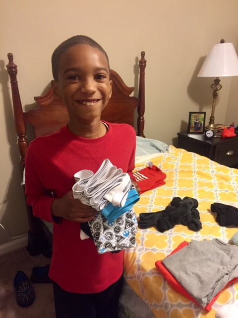 kid folding laundry