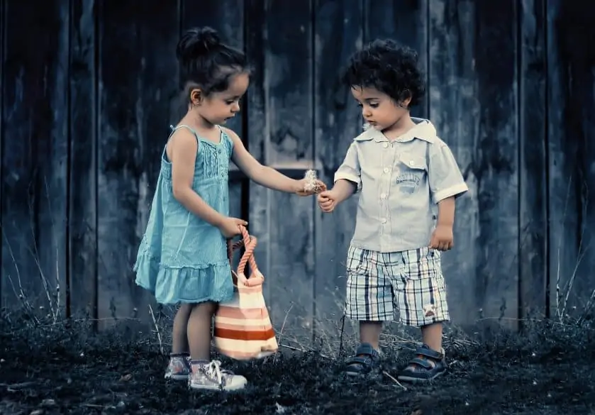 children picking dandelions