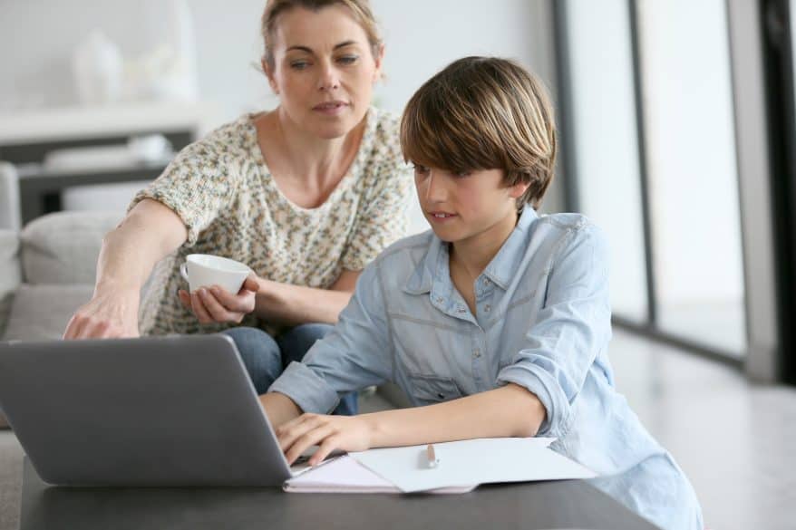 mother and son using computer