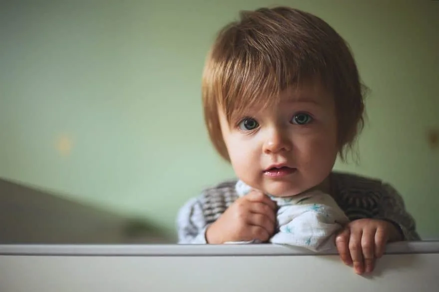 toddler in crib