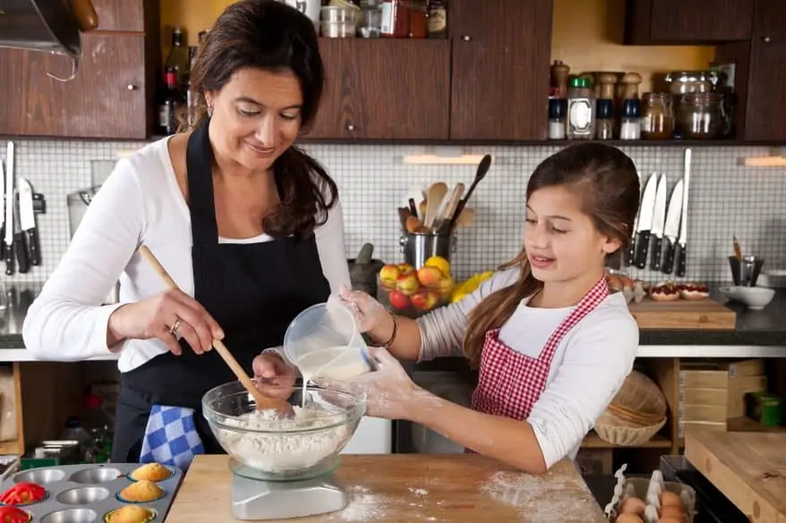 mom and daughter cooking