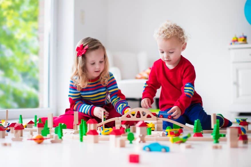 children playing with toy train