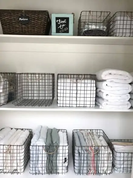 linens organized in wire baskets