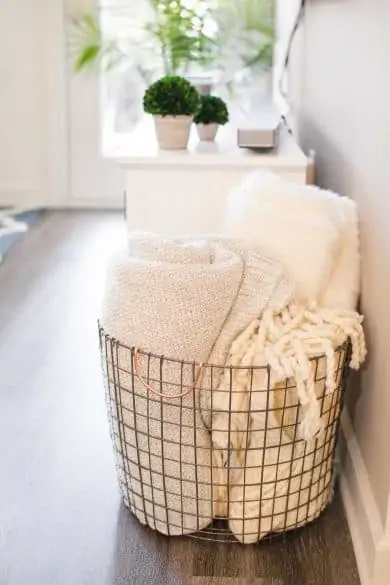 blankets in a wire basket