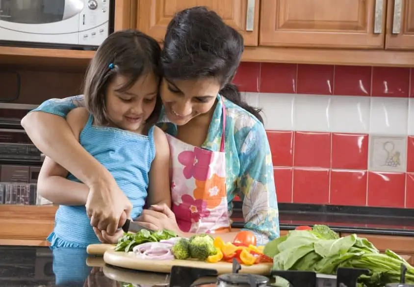 mother and daughter cooking