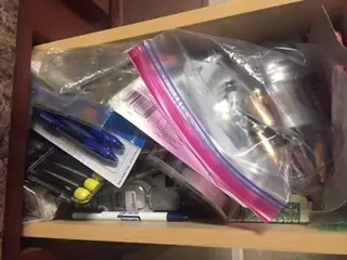 Collection of junk in drawer.