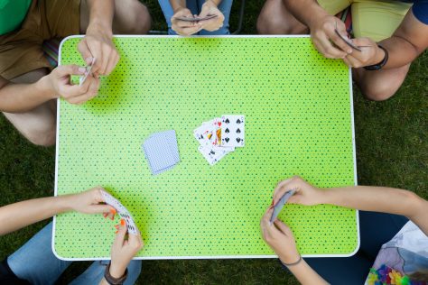 Playing cards outside camping activities