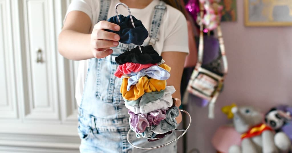 organize your scrunchies on a paper towel holder