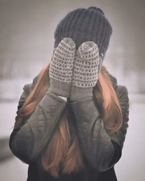 girl wearing mittens