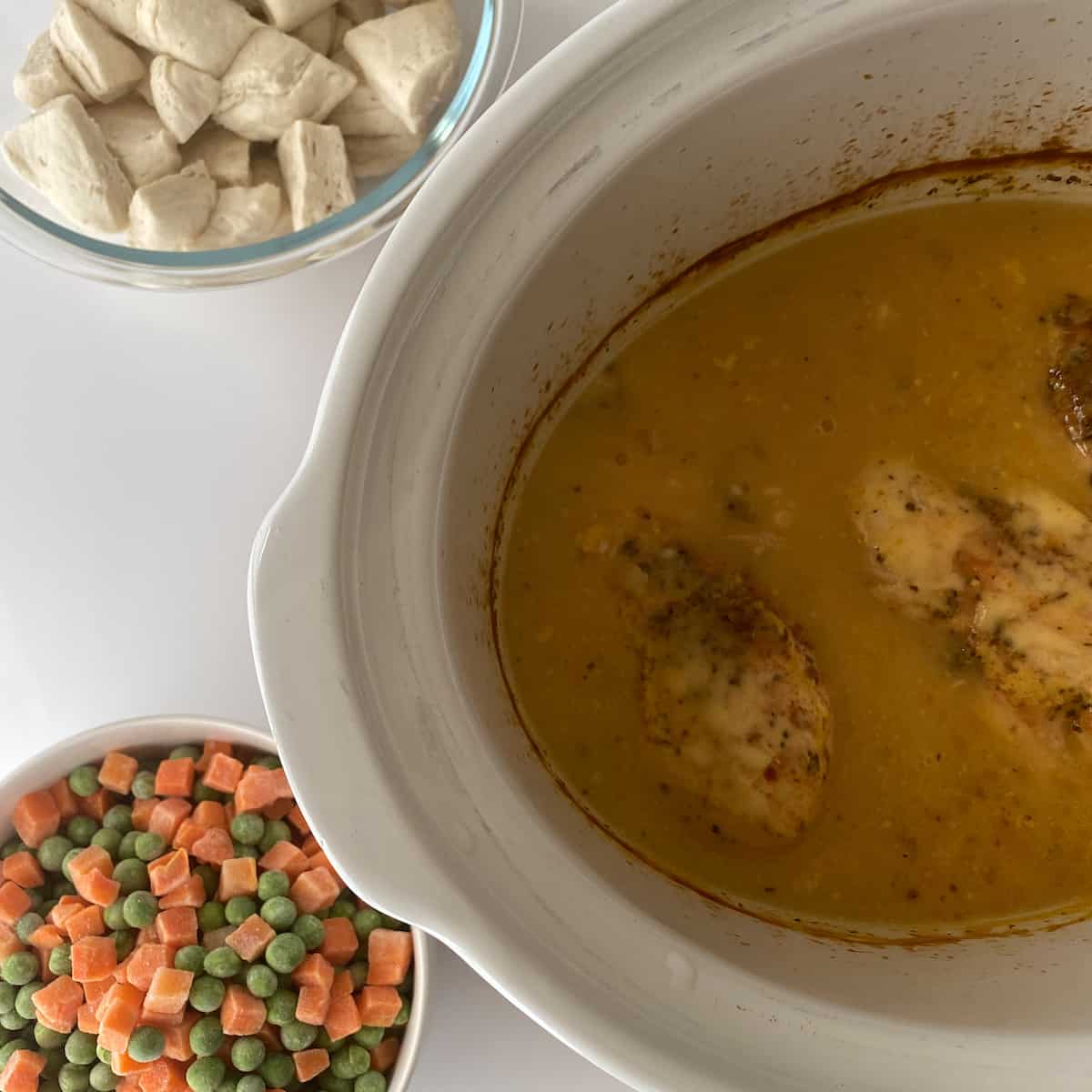 add vegetables and biscuits to crock pot chicken and dumplings