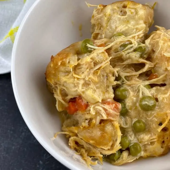 close up of bowl with chicken and dumplings made with canned biscuits