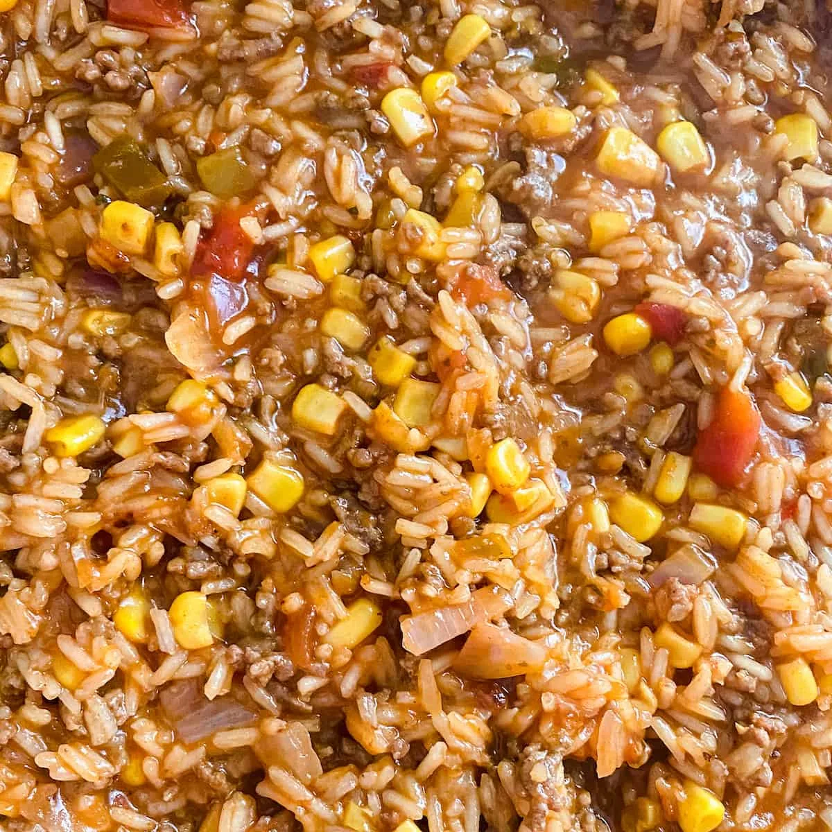 ground beef sauce rice and vegetables cooking