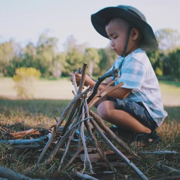 child with sticks kids saying I'm bored