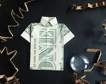 An origami shirt made out of a dollar bill.