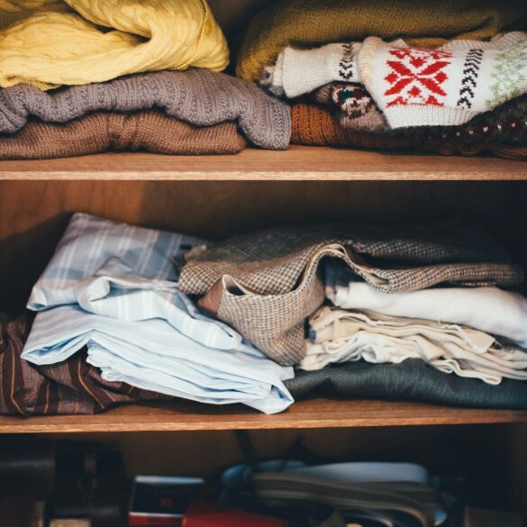 piles of clothes declutter before you move