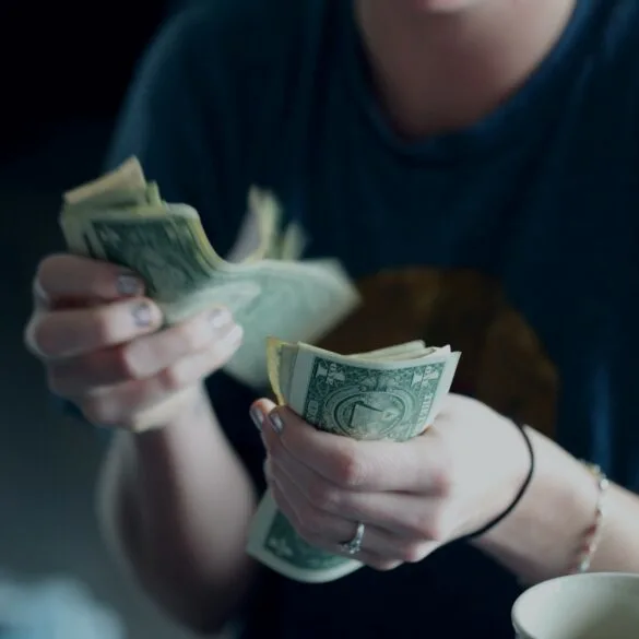 counting cash bills; Christmas budget