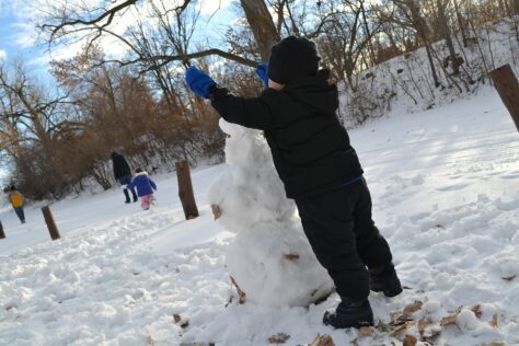 boy with snowman; winter family activities