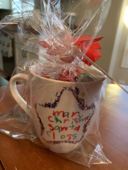 A finished and wrapped dotted Christmas mug.