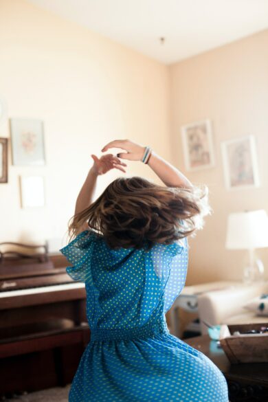 Girl twirling around.