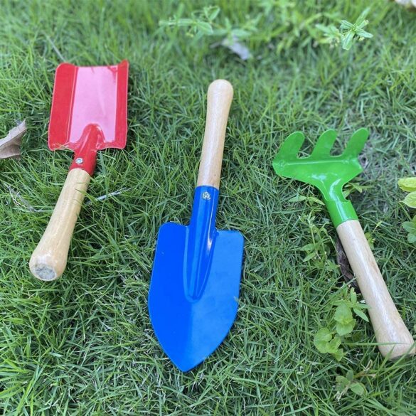 3 metal and wood gardening tools.