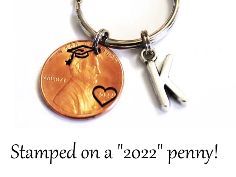 A 2022 penny with a heart around 2022 and a grad cap on Lincolns head.