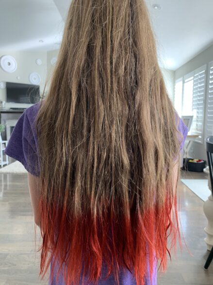 Dried Kool-Aid dyed hair ends in pink.