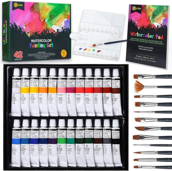 A watercolor set including brushes, paints, paper and a palette.
