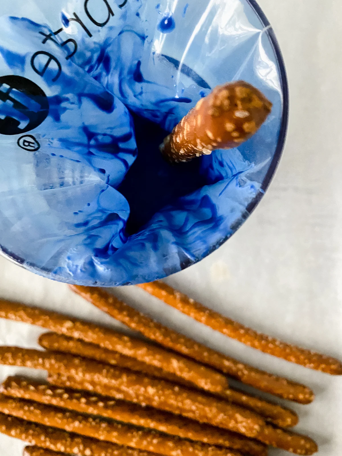 dipping pretzel rods in candy melts