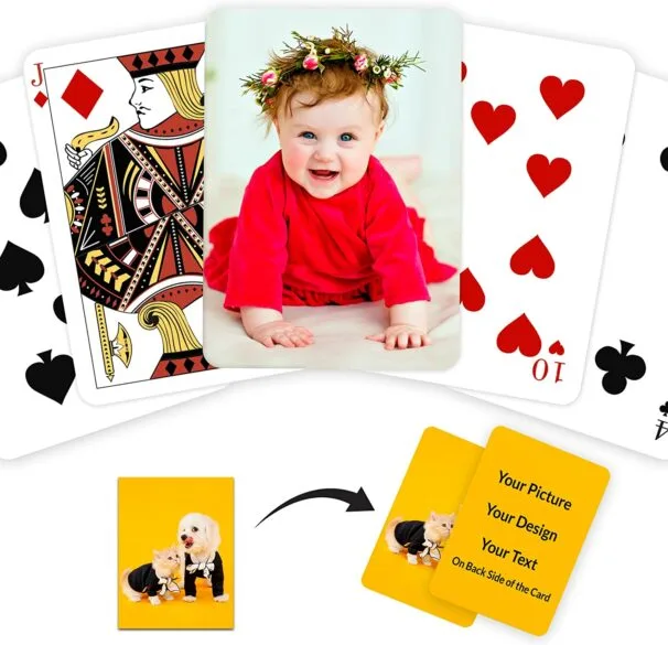 A deck of cards with a babies picture and a card with a cat and dog on it.