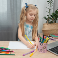 girl doing school work; homeschool curriculum for working mom