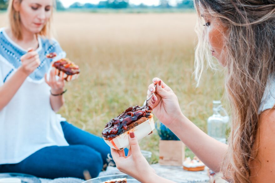 A mother and daughter having a picnic together