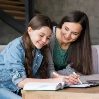 girl doing homework; Homeschool With Just Workbooks