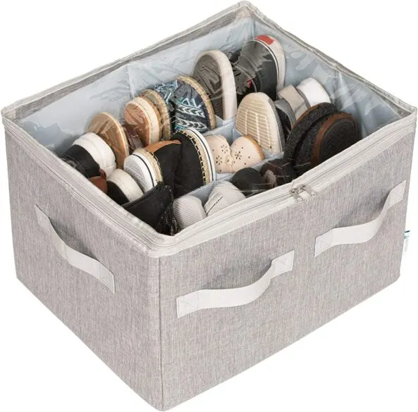 A canvas tote with dividers inside holding pairs of shoes.