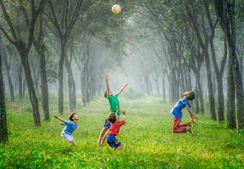 Children jumping to get a ball. Six Fun DIY Summer Activities