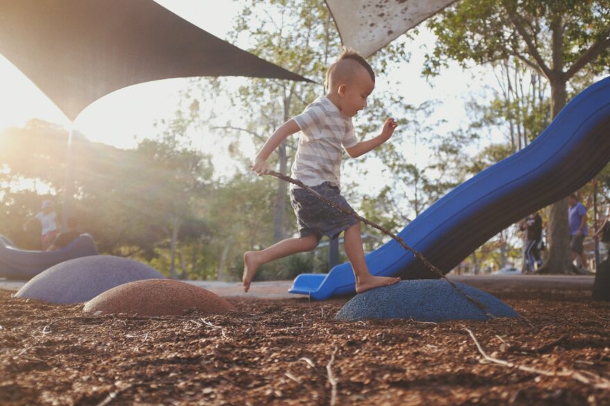 A boy playing on a playground; Six Fun DIY Summer Activities