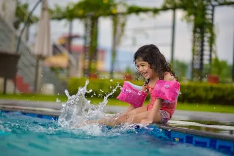 Girl playing in pool; Fun Family Water Activities