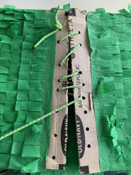 Holes at the top of the piñata for "sewing" shut.