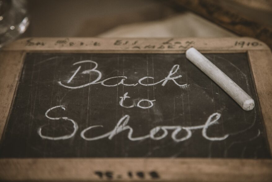 A small old personal chalkboard that says, Back to School.