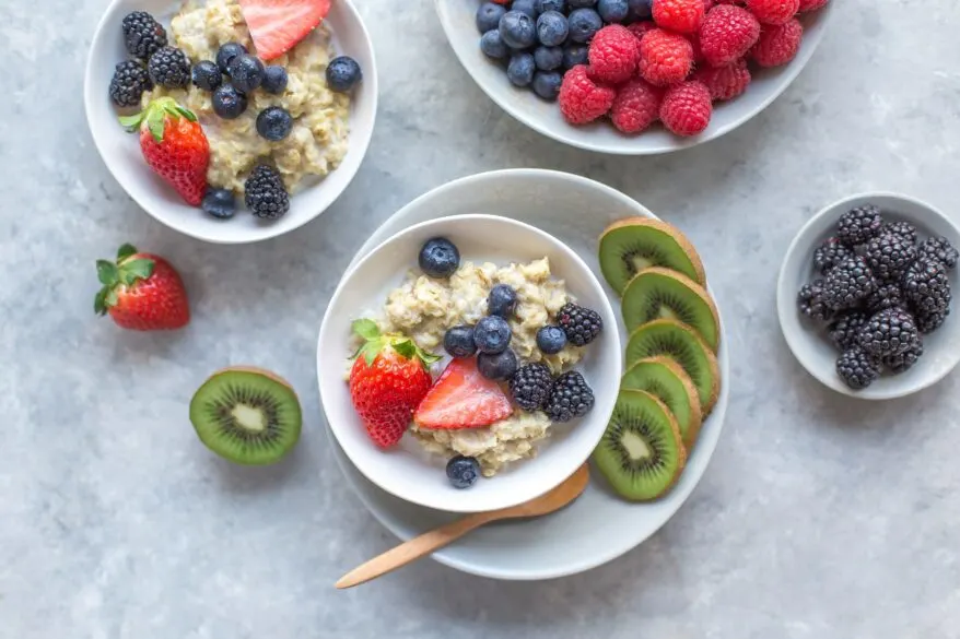 Bowls full of oatmeal and berries.