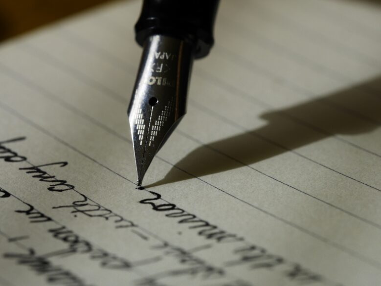 A paper with writing and the pen.