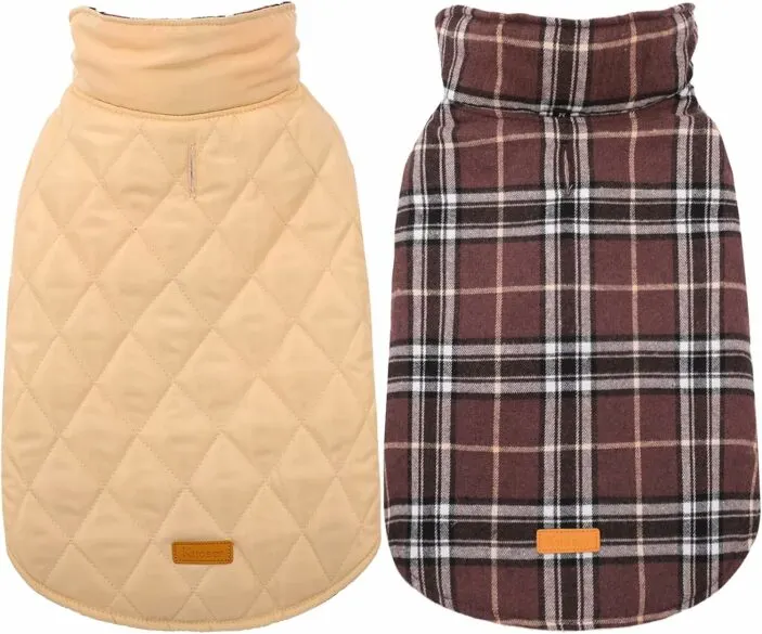 A dog jacket showing the waterproof side and the reversible plaid side.