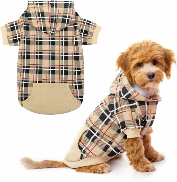 A dog wearing a plaid short sleeved hoodie.