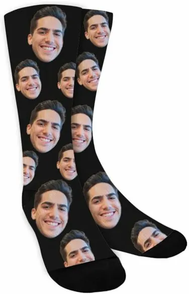 A pair of socks with someone's face on them.