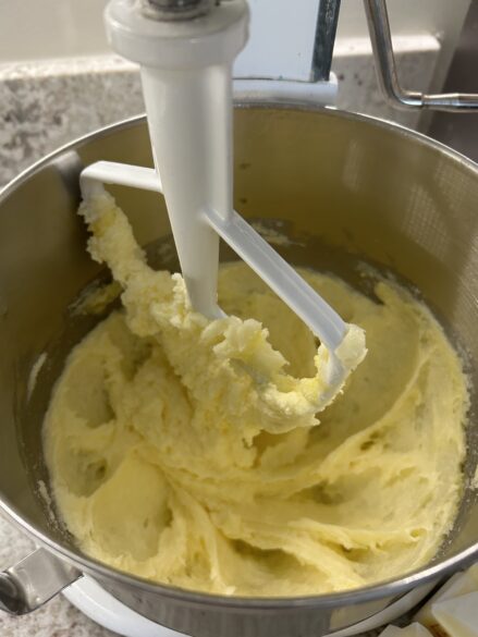 Mixing bowl with creamed butter and sugar.