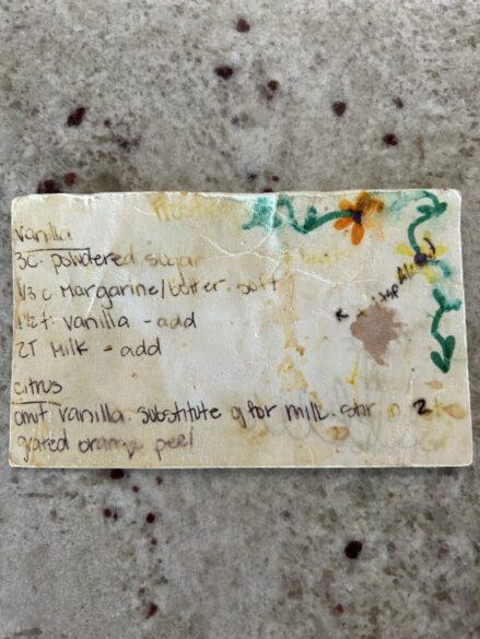 Written on recipe card with a frosting recipe.