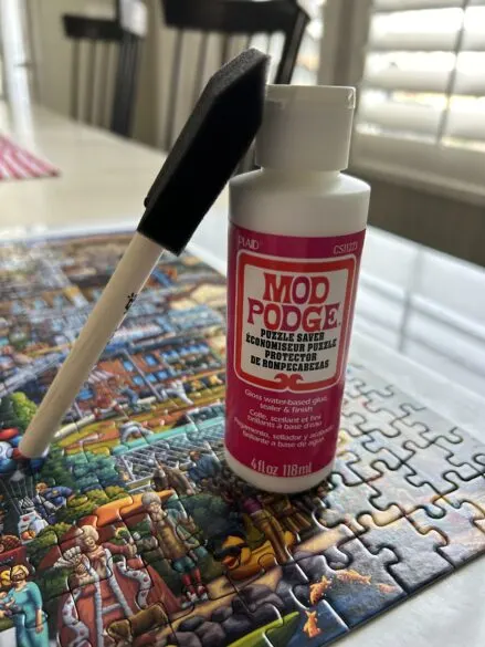 Mod Podge puzzle saver and a 2 inch foam brush.